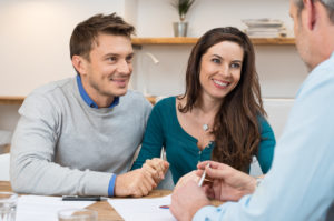 Young couple meeting financial advisor for investment
